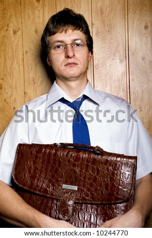 businessman with briefcase in a hand