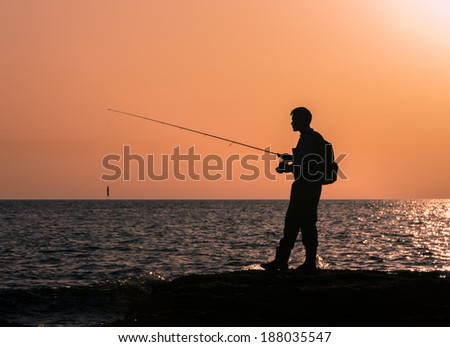 Fishing silhouette at sunset
