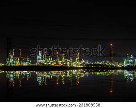 Industrial Refineries at  night reflected in the water HDR