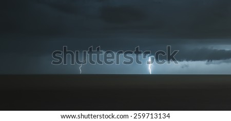 lightning bolts over the sea