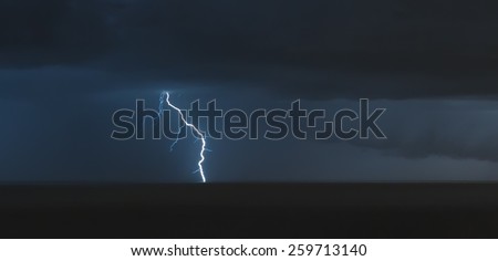 lightning bolts over the sea