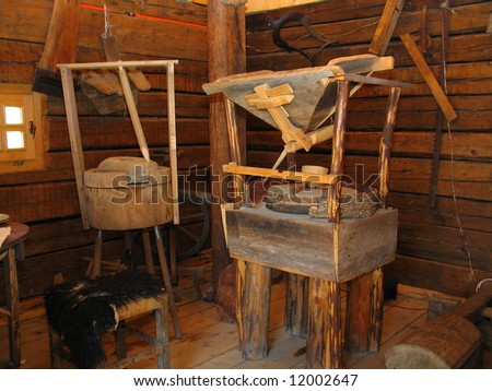Vintage wooden mill equipment inside genuine wooden mill interior