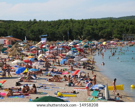PAG Island, Croatia, Adriatic sea - July 9:Big crowd of swimmers, hot summer day on Zrce beach, Novalja, Pag island, Croatia, Adriatic sea
