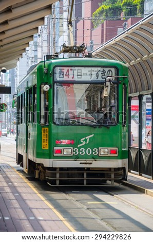 SAPPORO, JAPAN - JUNE 16, 2015 : Sapporo street car at the station on June 16, 2015. Sapporo street car is a tram network since 1909, located in Sapporo, Hokkaido, Japan.