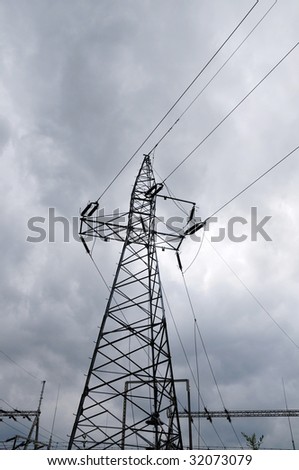 Electric power utility pole on cloudy sky