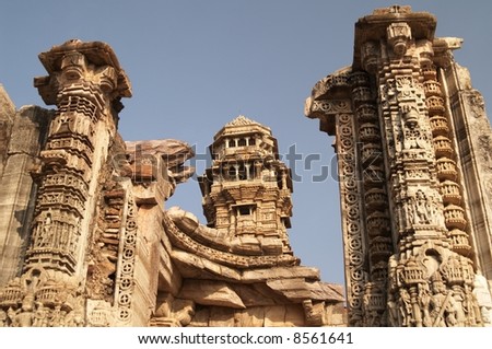 Ornate carved stone victory tower (Vijay Stambha) built to celebrate an ancient victory. Chittaugarh, Rajasthan, India.