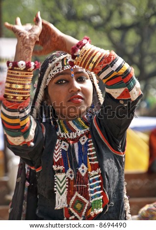 Indian lady dancing in traditional dress of a Rajasthani gypsy
