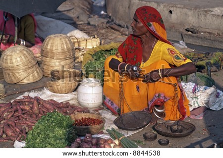 Woman selling fruit and vegetables by the roadside in Jaipur, India