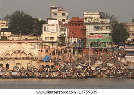 People crowding the ghats to bathe in the Ganges River at Varanasi
