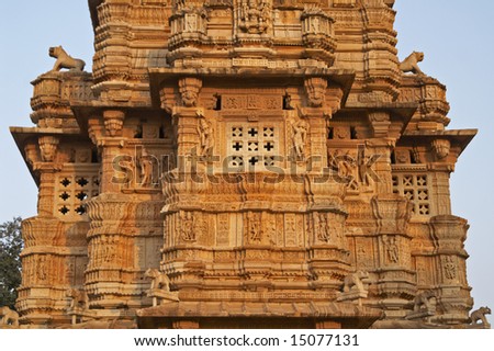 Detail of ornate carved stone tower built to celebrate an ancient victory. Chittaugarh, Rajasthan, India