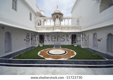 White walled courtyard inside the Lake Palace, Udaipur, Rajasthan, India
