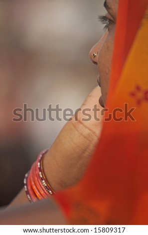 WAGAH BORDER POST, INDIA - JULY 24: Unidentified Indian lady in an orange sari. July 24, 2008 in Wagah, Punjab, India