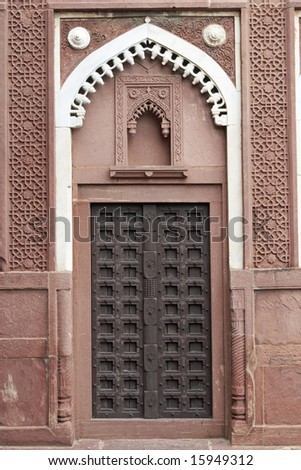 Mughal style decorated doorway in the Jahangiri Mahal Palace inside the Red Fort at Agra, Uttar Pradesh, India