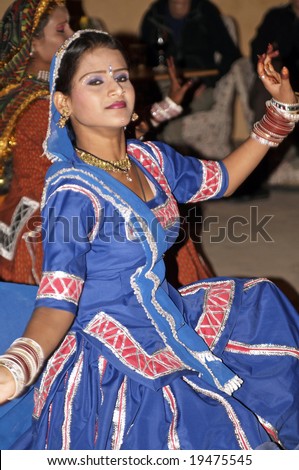 RAJASTHAN, INDIA - DECEMBER 30: Unknown Indian lady in colorful costume dancing December 30, 2006 at Neemrana, Rajasthan, India