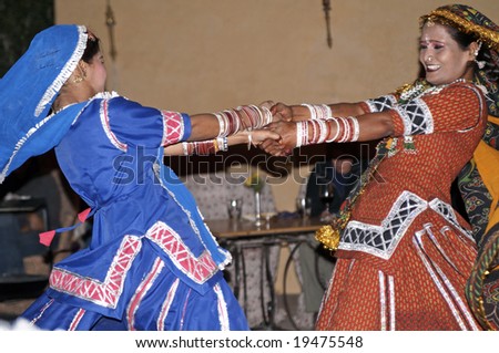 RAJASTHAN, INDIA - DECEMBER 30: Unknown Indian ladies in colorful costume dancing December 30, 2006 at Neemrana, Rajasthan, India