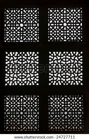 Patterned stone screen window of old Indian royal palace (Jahangir Mahal) in Orchha, Madhya Pradesh, India. 17th Century AD.