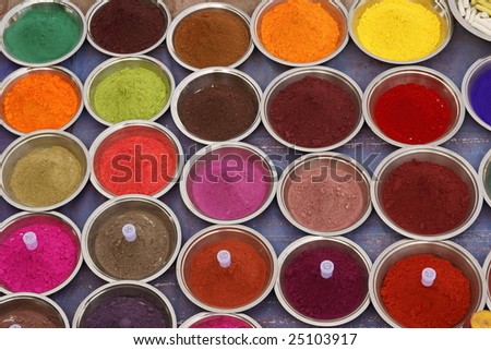 Colored religious powders at a market outside a Hindu temple. Orchha, Madhya Pradesh, India