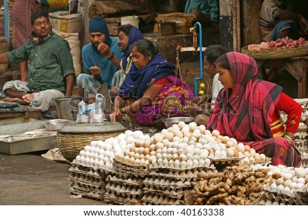 CALCUTTA, INDIA - DECEMBER 20: Indian people selling eggs and fish from street stalls on December 20, 2008 in the Chowringhee area of Calcutta, West Bengal, India.