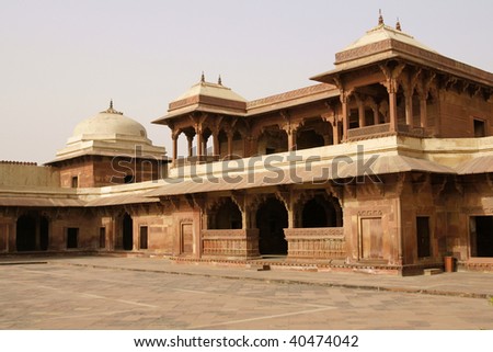 Deserted Mughal city of Fatehpur Sikri. Red sandstone buildings set around a courtyard. Uttar Pradesh, India. 16th Century AD.