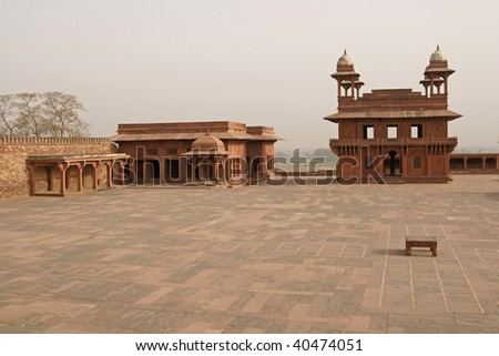 Deserted Mughal city of Fatehpur Sikri. Red sandstone buildings set around large courtyard. Uttar Pradesh, India. 16th Century AD.