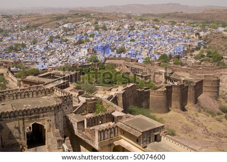 Ancient blue city of Jodhpur clustered around the battlements of Meherangarh Fort. Rajasthan, India