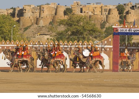 JAISALMER, INDIA - FEBRUARY 20: Camels and riders of the Indian Border Security Force perform in front of the Fort on February 20, 2008 during the Desert Festival in Jaisalmer, Rajasthan, India