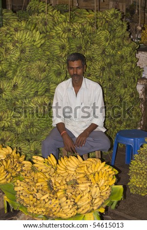 MYSORE, INDIA - JUNE 26: Unknown man selling bananas on June 26, 2007 in the market at Mysore, Karnataka, India