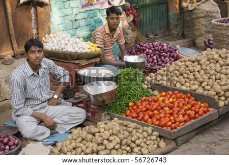DELHI, INDIA - FEB 5: Men selling vegetables from a pavement stall on February 5, 2009 in Delhi, India.
