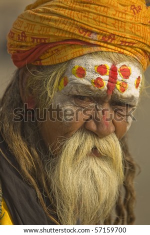 VARANASI, INDIA - 9 OCTOBER: Hindu Sadhu. Man with beard and painted face on October 9, 2007 in the sacred city of Varanasi, Uttar Pradesh, India