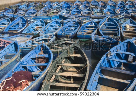 Fleet of small wooden fishing boats in the fishing village of Essaouira, Morocco.