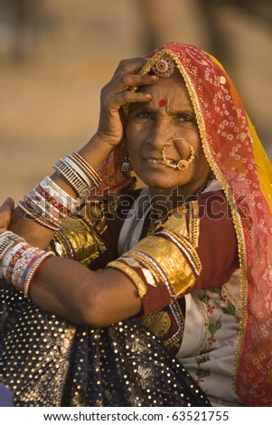 PUSHKAR, INDIA - NOVEMBER 9: Unknown indian lady in traditional tribal dress on November 9, 2008 at the annual camel fair in Pushkar, Rajasthan, India.