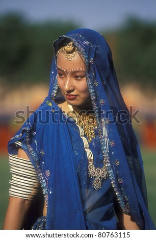 JODHPUR, INDIA - OCTOBER 6: Unidentified woman in a blue sari on October 6, 2006 at the annual Marwar Festival in Jodhpur, India. The festival includes a competition for the best dressed foreigner. This lady was a winner.