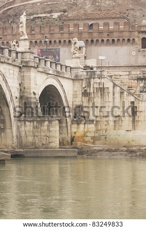 Statues line the bridge (Pont Sant\' Angelo) over the River Tiber leading to the ancient Castel Sant\' Angelo in Rome, Italy.
