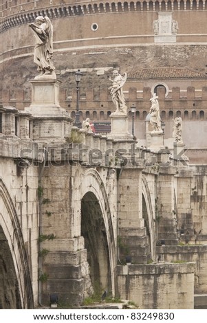 Statues line the bridge (Pont Sant' Angelo) over the River Tiber leading to the ancient Castel Sant' Angelo in Rome, Italy.