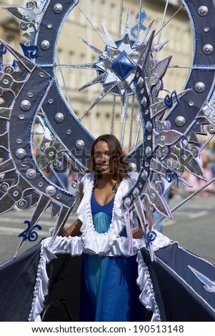 BATH, UNITED KINGDOM - AUGUST 25, 2012: Colorful carnival parade through the streets of Bath, Somerset as part of the celebrations for the London 2012 para olympics