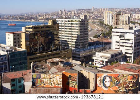 VALPARAISO, CHILE - MAY 16, 2014: Colourful murals decorating buildings in the commercial district of Valparaiso in Chile