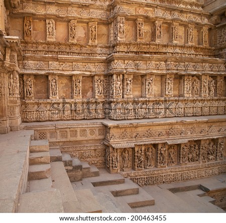 Ornate stone carved walls lining the 11th century Rav-Ki-Vav stepwell at Patan, Gujarat, India. Selected as a UNESCO world Heritage Site in June 2014.