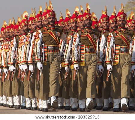 NEW DELHI, INDIA - JANUARY 23, 2008: Soldiers in bright red and gold headdress parading down the Raj Path in preparation for the annual Republic Day Parade in New Delhi, India