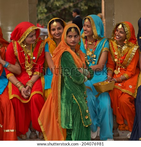 HARYANA, INDIA - FEBRUARY 15, 2007: Group of colorfully dressed Indian dancers from the Punjab region of India at the annual Surajkund Fair in Haryana, India