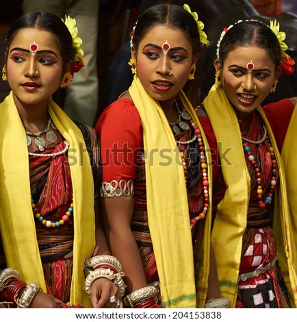 HARYANA, INDIA - FEBRUARY 12, 2009: Group of teenage Indian dancers in traditional tribal outfits at the Sarujkund Craft Fair in Haryana near Delhi, India.