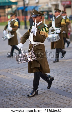 SANTIAGO, CHILE - AUGUST 12, 2014: Member of the Carabineros Band marching and playing the drum as part of the changing of the guard ceremony at La Moneda in Santiago, Chile.