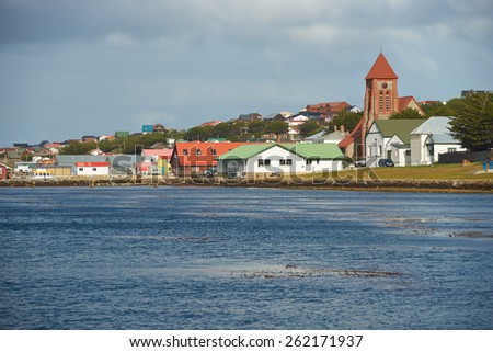 STANLEY, FALKLAND ISLANDS - FEBRUARY 13, 2015: Historic buildings along the sea shore in the small town of Stanley, capital of the Falkland Islands.