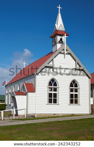 St Mary's Catholic Church in Stanley, capital of the Falkland Islands. Small wooden building with white walls and red tiled roof.