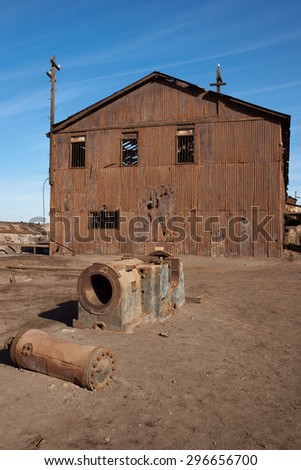 Derelict and rusting industrial building at the historic Humberstone Saltpeter Works in the Atacama Desert near Iquique in Chile. The site is now an open air museum and a Unesco World Heritage SIte.