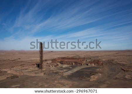 Derelict and rusting industrial buildings at the historic Humberstone Saltpeter Works in the Atacama Desert near Iquique in Chile. The site is now an open air museum and a Unesco World Heritage SIte.