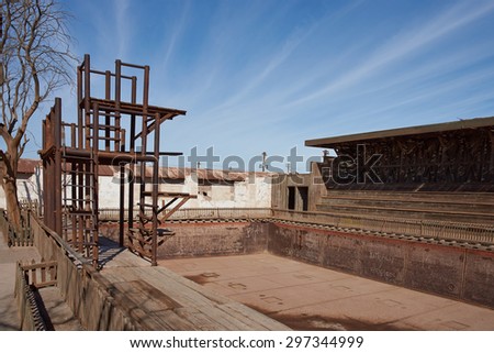 Derelict swimming pool and diving board at the historic Humberstone Saltpeter Works in the Atacama Desert in Chile. The site is now an open air museum and a Unesco World Heritage SIte.