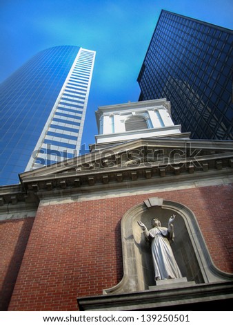 Old church between two skyscrapers in Battery Park, New York