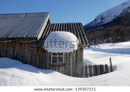 Old summer barn in a winter sunlit mountain landscape, Hemsedal-Norway