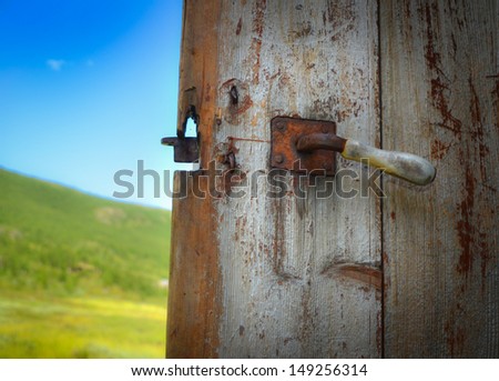 Old door with handle into the nature, Hemsedal - Norway