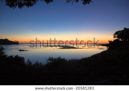 Sun sets on shell island in the gulf coast